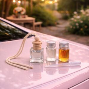 Набір: автомобільний дифузор з двома запасними флаконами аромаолії та піпеткою — «Пелюстки троянди»